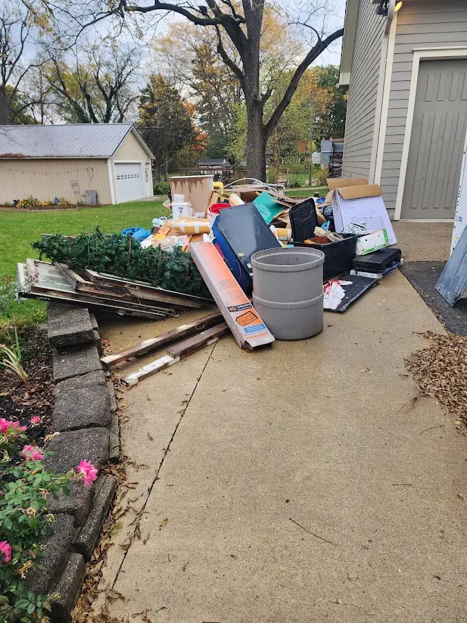 Dumpster being loaded with debris for Residential Dumpster Rental in Alondra Park